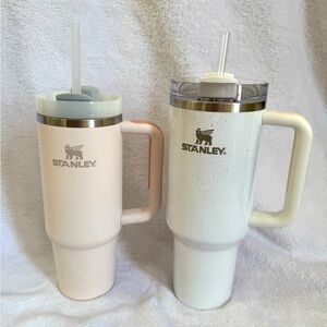 One pale pink 30oz Stanley and one 40oz white with glitter